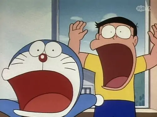 Ảnh troll Nobita ngồi cạnh Xeko khoe khoang, ánh mắt ghen tị lộ rõ sau cặp kính khi cuộc so bì trẻ con bắt đầu